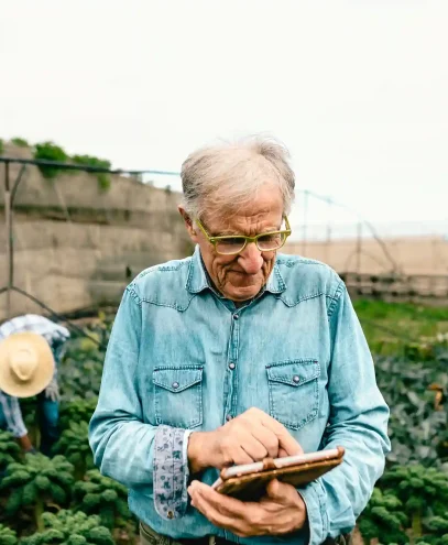 senior-agronomist-man-working-with-tablet-inside-a-2023-11-27-05-08-00-utc_6_11zon