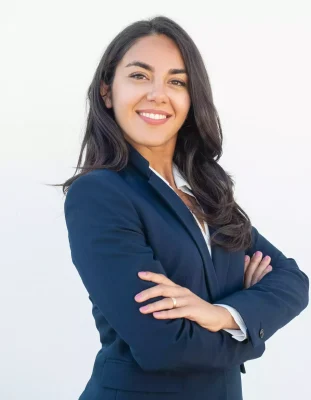 smiling-confident-businesswoman-posing-with-arms-folded-min