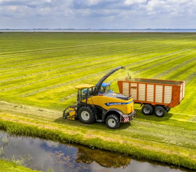 tractors-on-fresh-mowed-green-agricultural-grassla-2023-11-27-05-25-45-utc_8_11zon