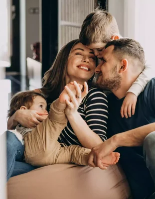 young-family-with-their-sons-home-having-fun-min